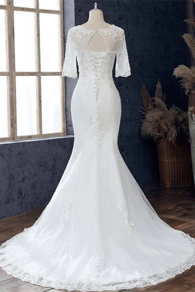 Vestido de novia de sirena con media manga y joya blanca